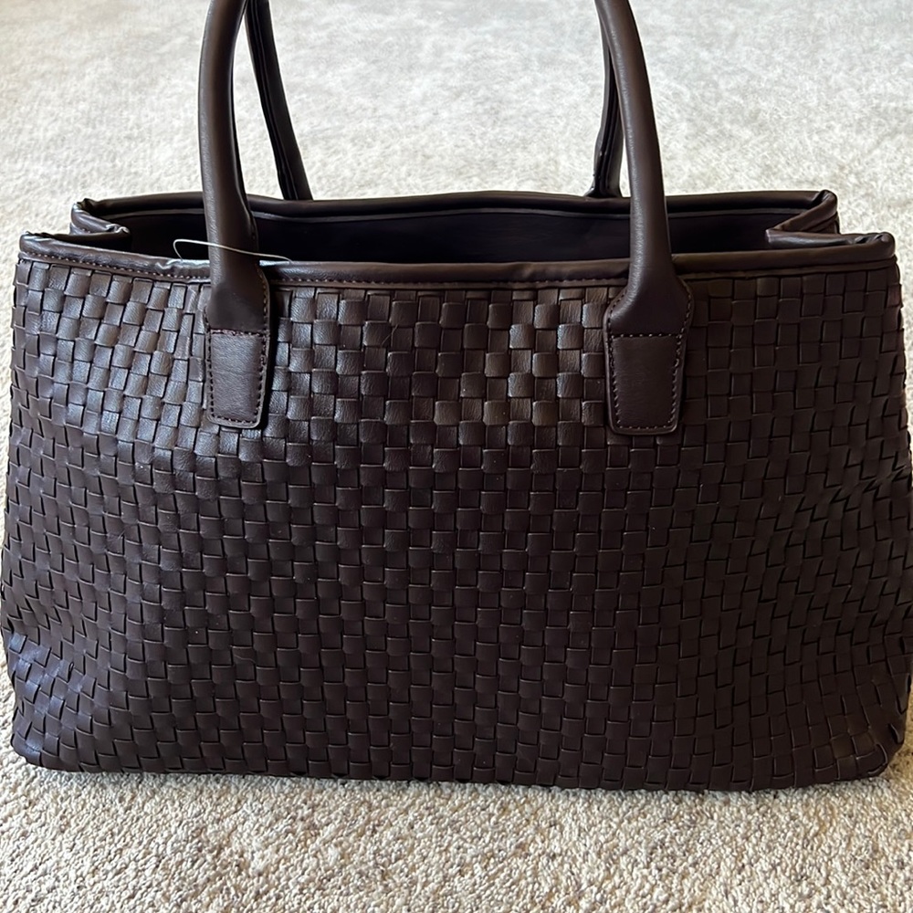 A large dark brown Lulu Dharma bag. It is new with tags.